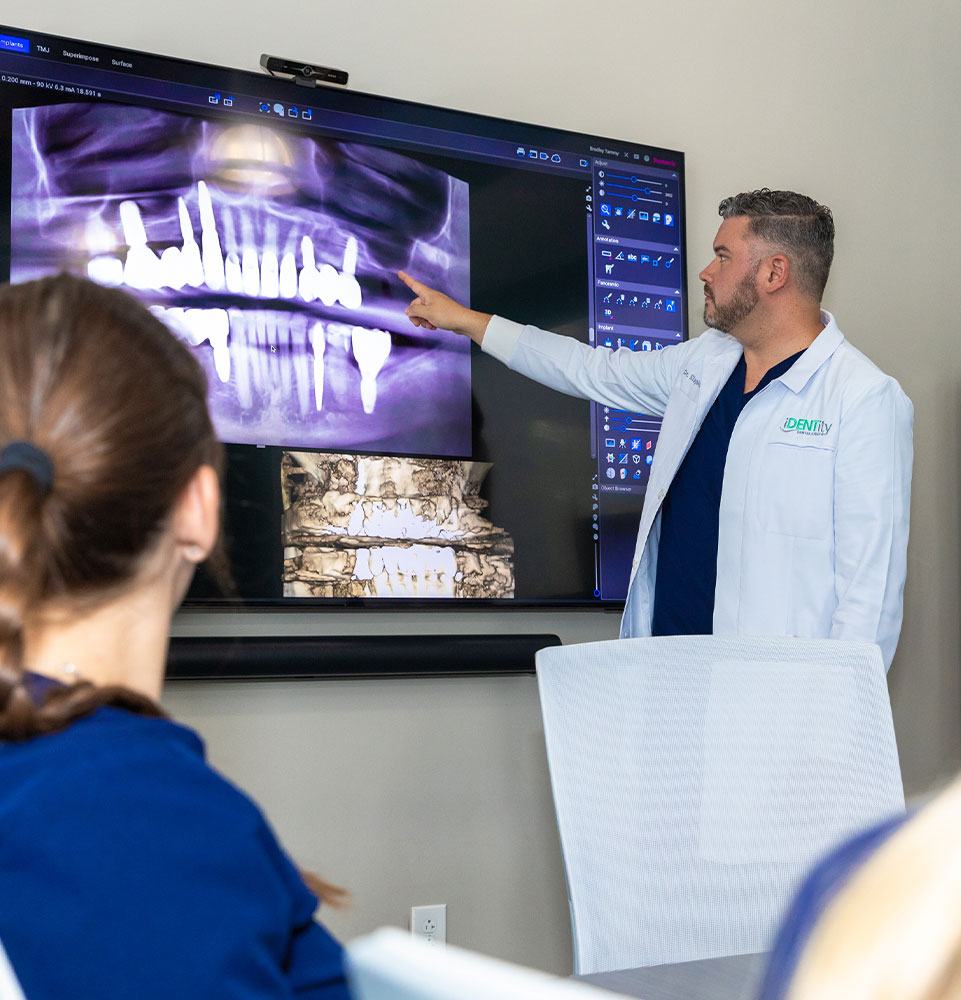 dental experts looking at xray